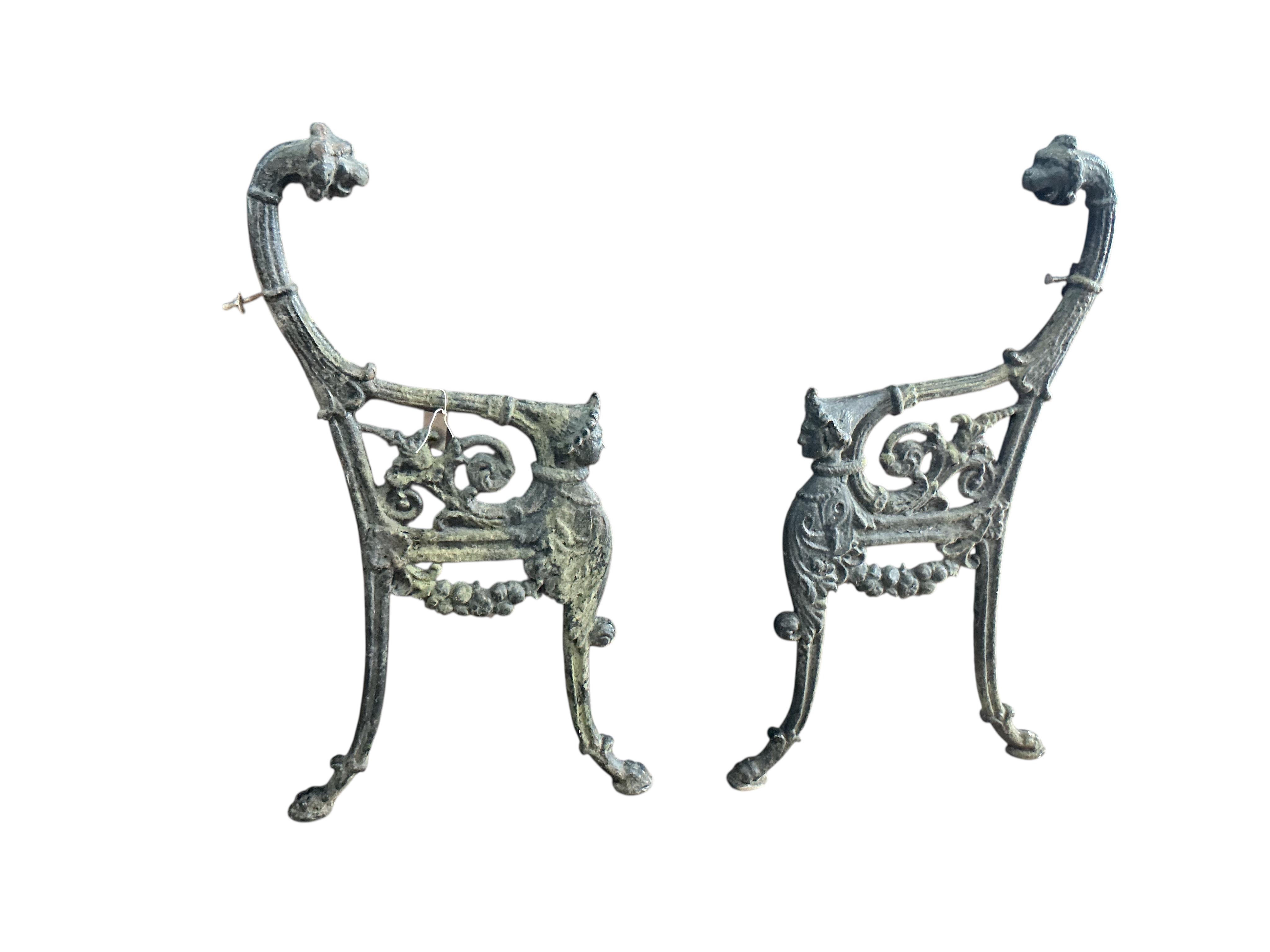 A pair of Victorian cast iron leopard's head bench ends, height 94cm